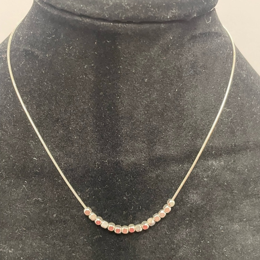 Necklace with small gold and silver tone beads. - Picture 1 of 3
